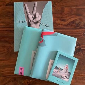 4 Tiffany & Co catalogs- two of them are sealed in the original envelope.